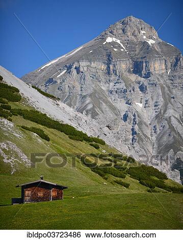 "Hut on an alpine meadow, Serles mountain at the back, Stubai Alps, Tyrol, Austria, Europe" View Large Photo Image Stock Photograph - "Hut on an alpine meadow, Serles mountain at the back, Stubai Alps, Tyrol, Austria, Europe". Fotosearch
