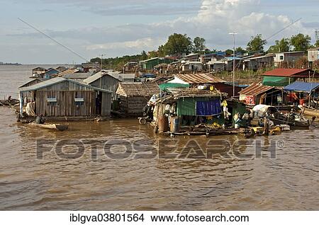 Picture - "Huts of a floating slum, on the banks of the Mekong River near Phnom Penh, Cambodia, Asia". Fotosearch