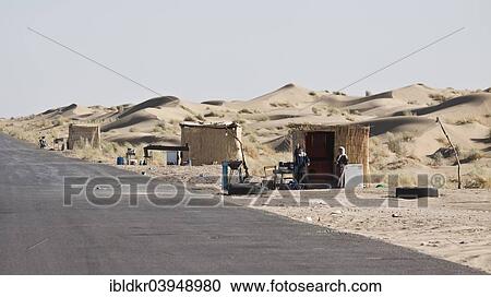 Stock Image - "Huts on the road, Derweze or Darvaza, Karakum Desert, Dashoguz, Turkmenistan, Asia". Fotosearch