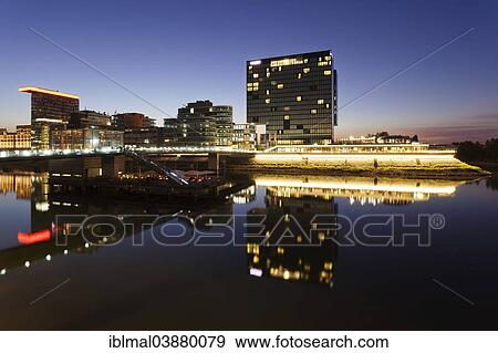 "Hyatt Hotel, Colorium building, Roggendorf House and the Cubana cocktail bar reflected in the water, Media Harbour, Dusseldorf, North Rhine-Westphalia, Germany, Europe" View Large Photo Image Stock Photo - "Hyatt Hotel, Colorium building, Roggendorf House and the Cubana cocktail bar reflected in the water, Media Harbour, Dusseldorf, North Rhine-Westphalia, Germany, Europe". Fotosearch