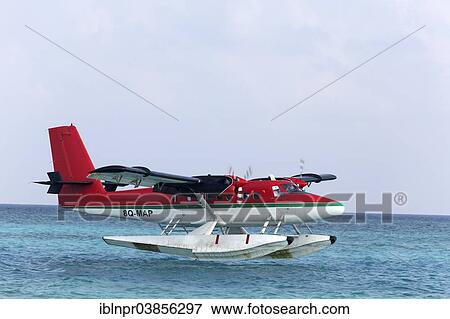 Stock Photo - "Hydroplane, De Havilland Canada DHC 6-300 Twin Otter, Trans Maldivian Airways, during the landing approach, Maldives, Asia". Fotosearch