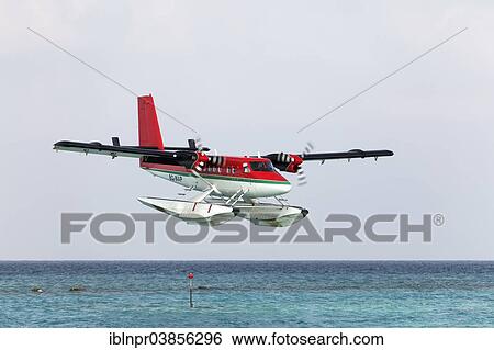 Stock Photograph - "Hydroplane, De Havilland Canada DHC 6-300 Twin Otter, Trans Maldivian Airways, during the landing approach, Maldives, Asia". Fotosearch