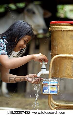 "Hygiene education through a charity, girl washing her hands, Trapang Village, Bathi District, Takeo Province, Cambodia, Asia" View Large Photo Image Stock Image - "Hygiene education through a charity, girl washing her hands, Trapang Village, Bathi District, Takeo Province, Cambodia, Asia". Fotosearch