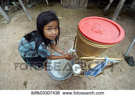 "Hygiene education through a charity, girl washing her hands, Trapang Village, Bathi District, Takeo Province, Cambodia, Asia" View Large Photo Image Stock Photograph - "Hygiene education through a charity, girl washing her hands, Trapang Village, Bathi District, Takeo Province, Cambodia, Asia". Fotosearch