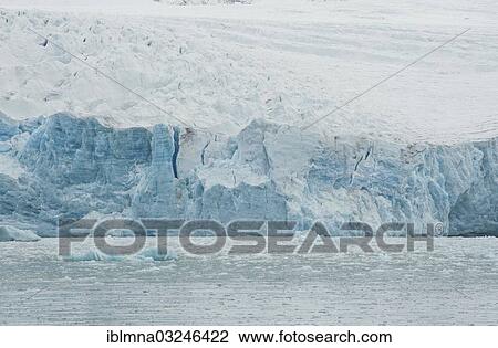 Stock Image - "Ice avalanche into the water of a fjord, Smeerenburgfjorden, Spitsbergen Island, Svalbard Archipelago, Svalbard and Jan Mayen, Norway, Europe". Fotosearch