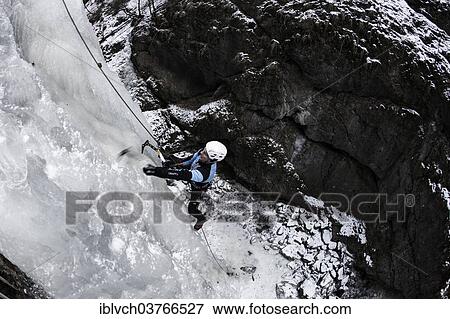 "Ice climber climbing a frozen waterfall, Alpbach, Alpbachtal valley, Reith im Alpbachtal, Tyrol, Austria, Europe" View Large Photo Image Stock Photo - "Ice climber climbing a frozen waterfall, Alpbach, Alpbachtal valley, Reith im Alpbachtal, Tyrol, Austria, Europe". Fotosearch