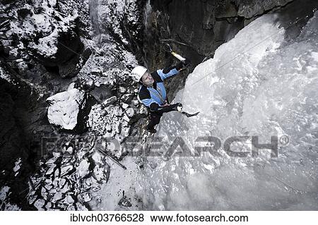 "Ice climber climbing a frozen waterfall, Alpbach, Alpbachtal valley, Reith im Alpbachtal, Tyrol, Austria, Europe" View Large Photo Image Stock Photo - "Ice climber climbing a frozen waterfall, Alpbach, Alpbachtal valley, Reith im Alpbachtal, Tyrol, Austria, Europe". Fotosearch