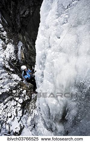"Ice climber climbing a frozen waterfall, Alpbach, Alpbachtal valley, Reith im Alpbachtal, Tyrol, Austria, Europe" View Large Photo Image Stock Photography - "Ice climber climbing a frozen waterfall, Alpbach, Alpbachtal valley, Reith im Alpbachtal, Tyrol, Austria, Europe". Fotosearch