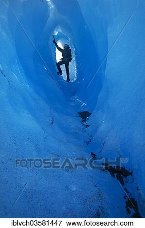 Stock Photo - "Ice climbing in an ice cave or glacier cave, Grey Glacier, Torres del Paine National Park, Chile, South America". Fotosearch