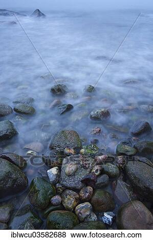"Ice cold Baltic Sea water surrounding the rocks, Jasmund National Park, Rugen, Mecklenburg-Western Pomerania, Germany, Europe" View Large Photo Image Stock Photo - "Ice cold Baltic Sea water surrounding the rocks, Jasmund National Park, Rugen, Mecklenburg-Western Pomerania, Germany, Europe". Fotosearch