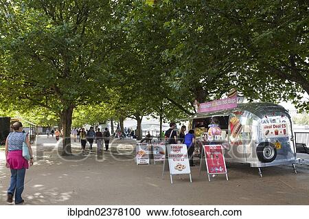 "Ice cream and donut van under the trees on the south bank of the Thames, London, England, United Kingdom, Europe" View Large Photo Image Stock Image - "Ice cream and donut van under the trees on the south bank of the Thames, London, England, United Kingdom, Europe". Fotosearch
