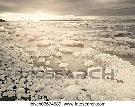 Stock Photo - "Ice floes in the midnight sun, Spitsbergen Island, Svalbard Archipelago, Svalbard and Jan Mayen, Norway, Europe". Fotosearch
