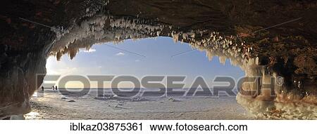 "Ice formations and icicles hanging from ceiling in a cave and people walking on frozen Lake Superior, Apostle Islands National Lakeshore, Bayfield, Wisconsin, USA" View Large Photo Image Stock Image - "Ice formations and icicles hanging from ceiling in a cave and people walking on frozen Lake Superior, Apostle Islands National Lakeshore, Bayfield, Wisconsin, USA". Fotosearch