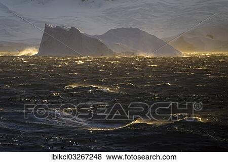 "Iceberg and the stormy sea in the evening light, Buttler Passage, Danco Coast, Antarctic Peninsula, Antarctica" View Large Photo Image Stock Photo - "Iceberg and the stormy sea in the evening light, Buttler Passage, Danco Coast, Antarctic Peninsula, Antarctica". Fotosearch