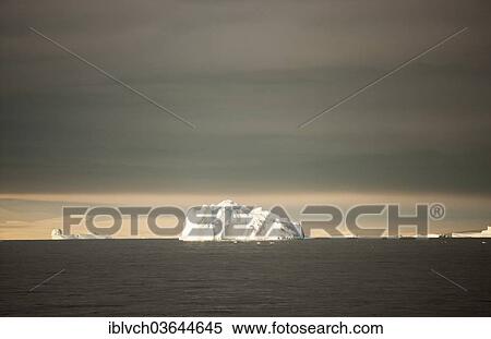 Stock Photography - "Iceberg in the morning light, Antarctic Peninsula, Antarctica". Fotosearch