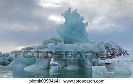 "Iceberg tourists in a rubber dinghy, at Monacobreen Glacier, Liefdefjorden, Spitsbergen, Svalbard Islands, Svalbard and Jan Mayen, Norway, Europe" View Large Photo Image Stock Image - "Iceberg tourists in a rubber dinghy, at Monacobreen Glacier, Liefdefjorden, Spitsbergen, Svalbard Islands, Svalbard and Jan Mayen, Norway, Europe". Fotosearch