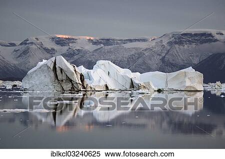 "Icebergs and mountains in the evening light with reflections, Rodefjord, Scoresbysund, Sermersooq, Greenland, North America" View Large Photo Image Stock Photography - "Icebergs and mountains in the evening light with reflections, Rodefjord, Scoresbysund, Sermersooq, Greenland, North America". Fotosearch
