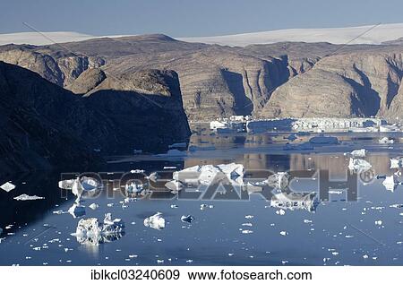 "Icebergs in the fjord of Nordvestfjorden, Greenlandic ice cap at the rear, Scoresbysund, Nordost-Gronland-Nationalpark, Greenland, North America" View Large Photo Image Stock Photo - "Icebergs in the fjord of Nordvestfjorden, Greenlandic ice cap at the rear, Scoresbysund, Nordost-Gronland-Nationalpark, Greenland, North America". Fotosearch
