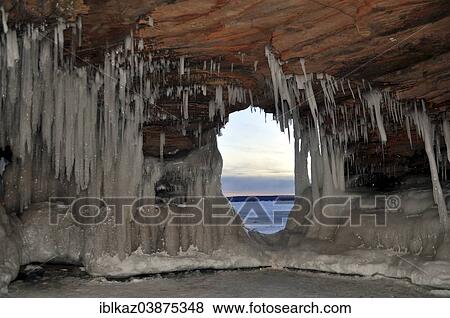 "Icicles and ice formations in a cave and view through a natural window onto frozen Lake Superior, Apostle Islands National Lakeshore, Bayfield, Wisconsin, USA" View Large Photo Image Stock Photo - "Icicles and ice formations in a cave and view through a natural window onto frozen Lake Superior, Apostle Islands National Lakeshore, Bayfield, Wisconsin, USA". Fotosearch