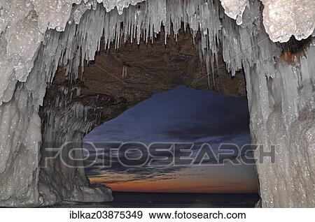 "Icicles and ice formations in a cave hanging from ceiling on the shore of frozen Lake Superior, Apostle Islands National Lakeshore, Bayfield, Wisconsin, USA" View Large Photo Image Stock Photo - "Icicles and ice formations in a cave hanging from ceiling on the shore of frozen Lake Superior, Apostle Islands National Lakeshore, Bayfield, Wisconsin, USA". Fotosearch