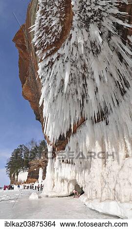 "Icicles hanging from red sandstone along the shore of Lake Superior, Apostle Islands National Lakeshore, Bayfield, Wisconsin" View Large Photo Image Picture - "Icicles hanging from red sandstone along the shore of Lake Superior, Apostle Islands National Lakeshore, Bayfield, Wisconsin". Fotosearch