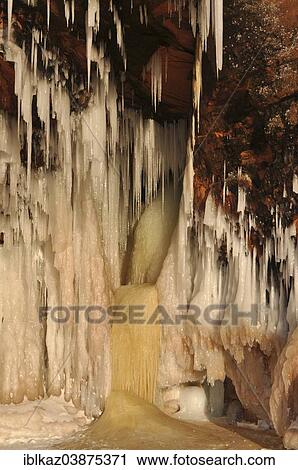 "Icicles hanging from red sandstone cliff, Apostle Islands National Lakeshore, Lake Superior, Bayfield, Wisconsin, USA" View Large Photo Image Stock Image - "Icicles hanging from red sandstone cliff, Apostle Islands National Lakeshore, Lake Superior, Bayfield, Wisconsin, USA". Fotosearch