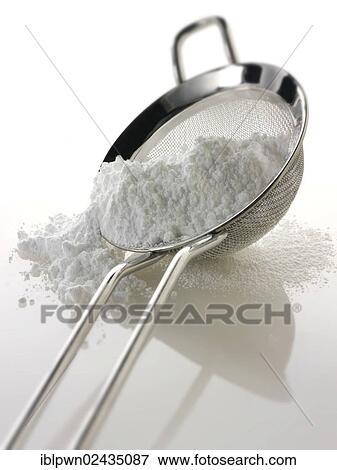 Stock Photo - Icing sugar on a sieve. Fotosearch