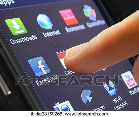 "Icon of a smartphone app being selected by a finger, close up" View Large Photo Image Stock Photo - "Icon of a smartphone app being selected by a finger, close up". Fotosearch