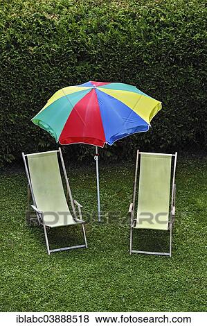"Idyllic garden scene, two beach chairs and a parasol in a garden, Bavaria, Germany, Europe" View Large Photo Image Stock Photo - "Idyllic garden scene, two beach chairs and a parasol in a garden, Bavaria, Germany, Europe". Fotosearch