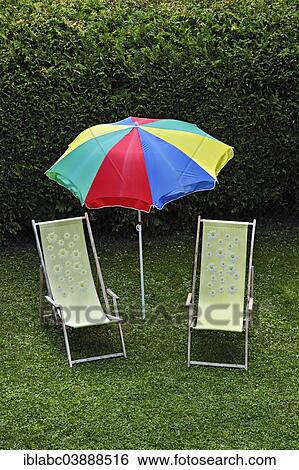 "Idyllic garden scene, two beach chairs and a parasol in a garden, Bavaria, Germany, Europe" View Large Photo Image Stock Photograph - "Idyllic garden scene, two beach chairs and a parasol in a garden, Bavaria, Germany, Europe". Fotosearch