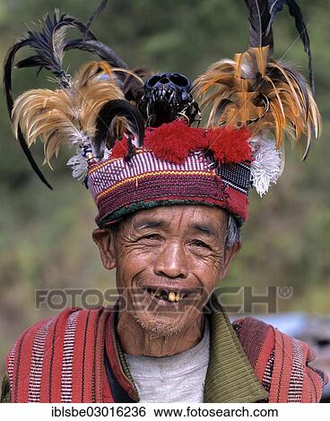 "Ifugao man, a member of an ethnic group wearing a traditional costume, portrait with a hat, bad teeth, Banaue Rice Terraces, also known as musuan peak, at the back, Banaue, Ifugao, Luzon, Philippines, Asia" View Large Photo Image Stock Photograph - "Ifugao man, a member of an ethnic group wearing a traditional costume, portrait with a hat, bad teeth, Banaue Rice Terraces, also known as musuan peak, at the back, Banaue, Ifugao, Luzon, Philippines, Asia". Fotosearch