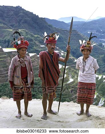 "Ifugao people, members of an ethnic group wearing traditional costumes, Banaue Rice Terraces, also known as musuan peak, at the back, Banaue, Ifugao, Luzon, Philippines, Asia" View Large Photo Image Stock Image - "Ifugao people, members of an ethnic group wearing traditional costumes, Banaue Rice Terraces, also known as musuan peak, at the back, Banaue, Ifugao, Luzon, Philippines, Asia". Fotosearch