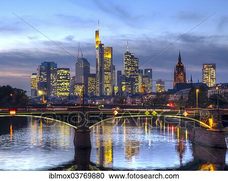 Stock Image - "Ignatz-Bubis-Brucke bridge, behind the skyline of Frankfurt, Frankfurt am Main, Hesse, Germany, Europe". Fotosearch