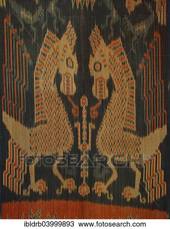 Stock Image - "Ikat Sumba, Warp Ikat, cotton, natural colours, indigo, mythological animals, before 1914, East Sumba, Lesser Sunda Islands, Indonesia, Asia". Fotosearch