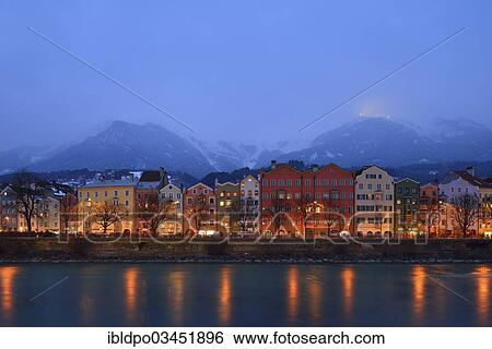 "Illuminated buildings along the Inn river at dusk, Innsbruck, Tyrol, Austria, Europe" View Large Photo Image Stock Photograph - "Illuminated buildings along the Inn river at dusk, Innsbruck, Tyrol, Austria, Europe". Fotosearch