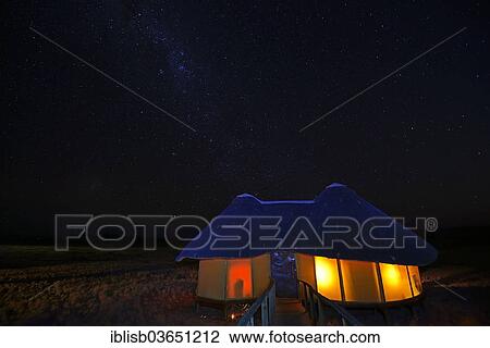 "Illuminated chalet or cabin of the Sossus Dune Lodge at night, under a starry sky with the Milky Way, Sossusvlei, Namib Desert, Namib Naukluft Park, Namibia, Africa" View Large Photo Image Stock Image - "Illuminated chalet or cabin of the Sossus Dune Lodge at night, under a starry sky with the Milky Way, Sossusvlei, Namib Desert, Namib Naukluft Park, Namibia, Africa". Fotosearch