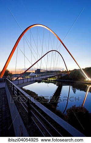"Illuminated double arch bridge over the Rhine-Herne Canal, Nordsternpark, former Nordstern colliery, Gelsenkirchen, North Rhine-Westphalia, Germany, Europe" View Large Photo Image Stock Photography - "Illuminated double arch bridge over the Rhine-Herne Canal, Nordsternpark, former Nordstern colliery, Gelsenkirchen, North Rhine-Westphalia, Germany, Europe". Fotosearch