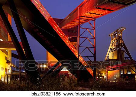 "Illuminated gangway to the Ruhr Museum at the Zeche Zollverein Coal Mine Shaft XII with the headframe, Essen, Ruhr area, North Rhine-Westphalia, Germany, Europe" View Large Photo Image Stock Photograph - "Illuminated gangway to the Ruhr Museum at the Zeche Zollverein Coal Mine Shaft XII with the headframe, Essen, Ruhr area, North Rhine-Westphalia, Germany, Europe". Fotosearch