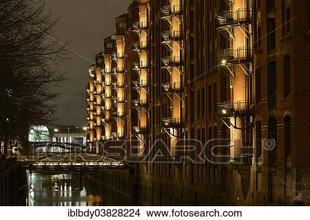 "Illuminated Kontorhaus office buildings in Hamburg's Speicherstadt historic warehouse district, Hamburg, Germany, Europe" View Large Photo Image Picture - "Illuminated Kontorhaus office buildings in Hamburg's Speicherstadt historic warehouse district, Hamburg, Germany, Europe". Fotosearch