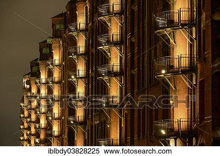 "Illuminated Kontorhaus office buildings in Hamburg's Speicherstadt historic warehouse district, Hamburg, Germany, Europe" View Large Photo Image Stock Photography - "Illuminated Kontorhaus office buildings in Hamburg's Speicherstadt historic warehouse district, Hamburg, Germany, Europe". Fotosearch