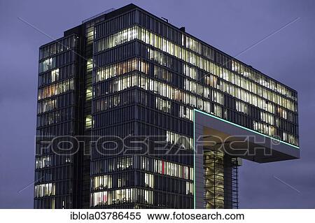 "Illuminated Kranhaus Mitte office building at dusk, Rheinauhafen, Cologne, North Rhine-Westphalia, Germany, Europe" View Large Photo Image Stock Photography - "Illuminated Kranhaus Mitte office building at dusk, Rheinauhafen, Cologne, North Rhine-Westphalia, Germany, Europe". Fotosearch