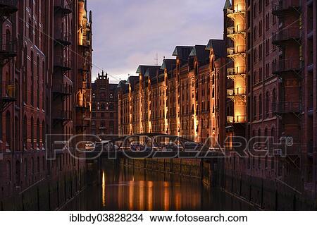 "Illuminated office buildings in Hamburg's Speicherstadt historic warehouse district, Hamburg, Germany, Europe" View Large Photo Image Picture - "Illuminated office buildings in Hamburg's Speicherstadt historic warehouse district, Hamburg, Germany, Europe". Fotosearch