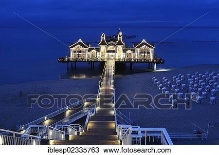"Illuminated pier at the Baltic Sea resort of Sellin, Baltic Seaside Resort Sellin, Rugen, Mecklenburg-Western Pomerania, Germany, Europe" View Large Photo Image Stock Image - "Illuminated pier at the Baltic Sea resort of Sellin, Baltic Seaside Resort Sellin, Rugen, Mecklenburg-Western Pomerania, Germany, Europe". Fotosearch