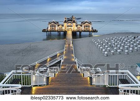 Stock Image - "Illuminated pier, Baltic Sea resort of Sellin, Baltic Seaside Resort Sellin, Rugen, Mecklenburg-Western Pomerania, Germany, Europe". Fotosearch