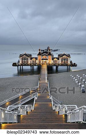 Stock Image - "Illuminated pier, Baltic Sea resort town of Sellin, Baltic Seaside Resort Sellin, Rugen, Mecklenburg-Western Pomerania, Germany, Europe". Fotosearch