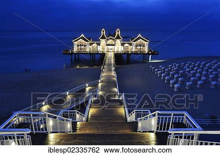 Stock Image - "Illuminated pier, Baltic Seaside Resort Sellin, Rugen, Mecklenburg-Western Pomerania, Germany, Europe". Fotosearch