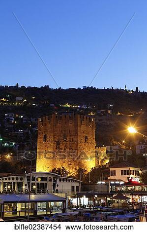 Picture - "Illuminated Red Tower in the port of Alanya, Antalya, Turkish Riviera, Turkey, Asia". Fotosearch