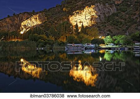 Stock Photo - "Illuminated Rock Tombs of Kaunas on the Dalyan River, Dalyan, Mugla Province, Turkish Riviera or Turquoise Coast, Aegean, Turkey, Asia". Fotosearch