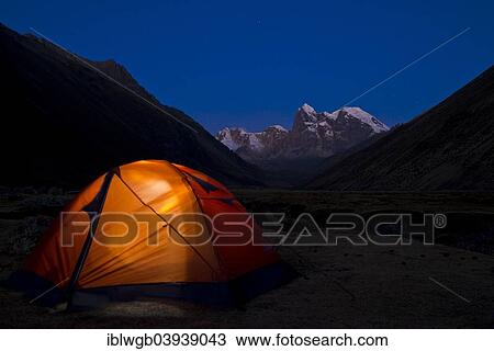 "Illuminated tent at Laguna Jahuacocha lake at dusk, snow-capped mountains at the back, Cordillera Huayhuash range, Northern Peru, Peru, South America" View Large Photo Image Stock Image - "Illuminated tent at Laguna Jahuacocha lake at dusk, snow-capped mountains at the back, Cordillera Huayhuash range, Northern Peru, Peru, South America". Fotosearch