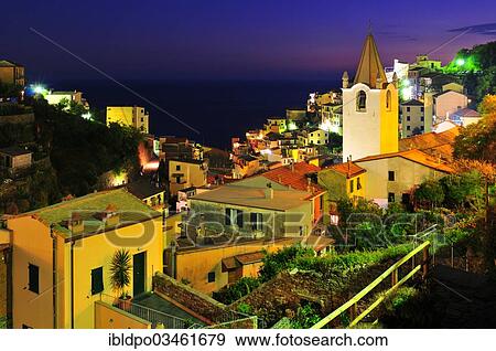 "Illuminated village of Riomaggiore at night, Riomaggiore, Cinque Terre, Liguria, Italy, Europe" View Large Photo Image Stock Photo - "Illuminated village of Riomaggiore at night, Riomaggiore, Cinque Terre, Liguria, Italy, Europe". Fotosearch
